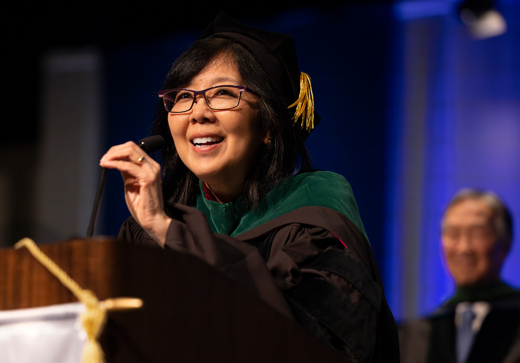 Karen Kim, dean of Penn State College of Medicine, gestures while speaking at commencement